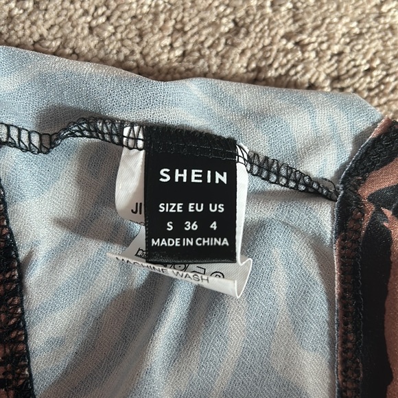 A crop top from SHEIN. Never been worn fabric is good.Zebra striped cowl shirt. - Picture 5 of 6